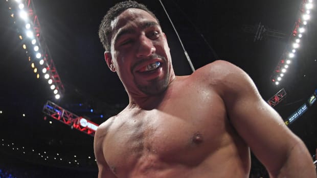 Boxer Danny Garcia smiles at the camera during a fight.