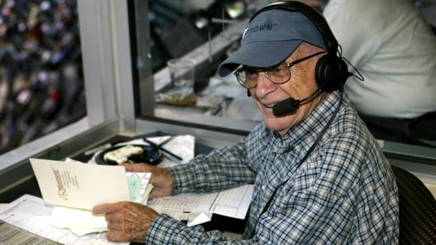 Detroit Tigers announcer Ernie Harwell in the broadcast booth Sept. 16, 2002, after leaving the game earlier to check on his wife, Lulu, who became ill during the Tigers celebration in his honor the day before.