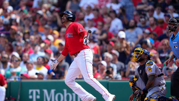 Jul 31, 2022; Boston, Massachusetts, USA; Boston Red Sox designated hitter J.D. Martinez (28) hits a double against the Milwaukee Brewers during the fourth inning at Fenway Park.