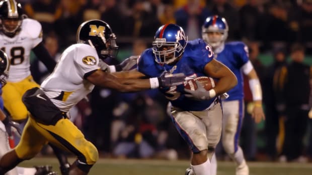 Nov 24, 2007; Kansas City, MO, USA; Kansas Jayhawks fullback (35) Brandon McAnderson rushes for a touchdown against the Missouri Tigers safety (1) William Moore in the second half at Arrowhead Stadium in Kansas City, MO.