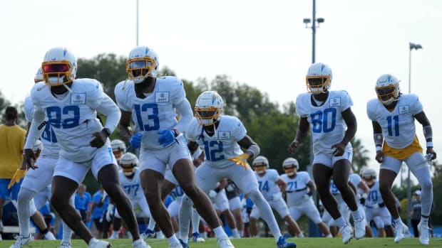 Aug 1, 2022; Costa Mesa, CA, USA; Los Angeles Chargers receivers Keenan Allen (13), Joe Reed (12), Maurice Ffrench (80) and Jason Moore Jr. (11) participate in drills during training camp at the Jack Hammett Sports Complex. Mandatory Credit: Kirby Lee-USA TODAY Sports