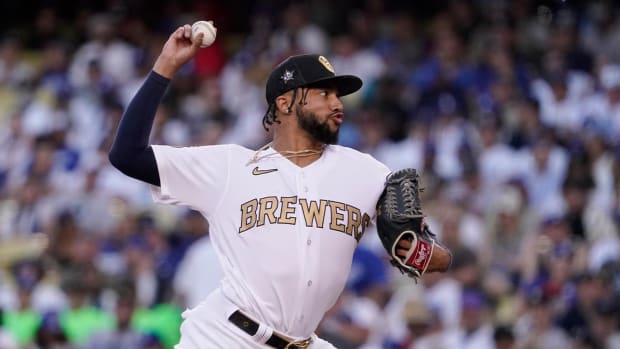 National League pitcher Devin Williams, of the Milwaukee Brewers, throws a pitch to the American League during the seventh inning of the MLB All-Star baseball game, Tuesday, July 19, 2022, in Los Angeles.