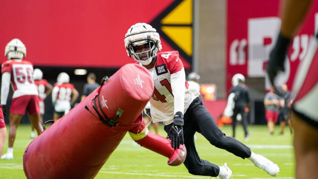 Arizona Cardinals outside linebacker Myjai Sanders (41) pushes over a tackling dummy during the Cardinals first public practice of the season at State Farm Stadium in Glendale on July 30, 2022. Nfl Cardinals Back Together Saturday Practice