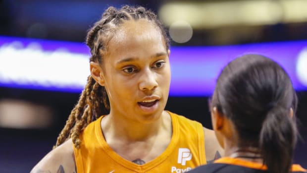 Mercury center Brittney Griner talks with a referee after a no-call in a games against the Aces.