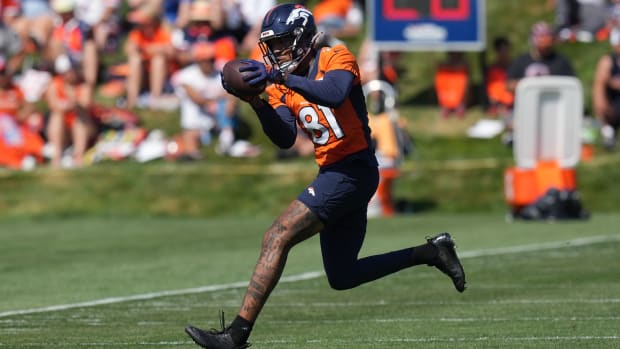 Broncos wide receiver Tim Patrick (81) catches the ball during training camp practice.