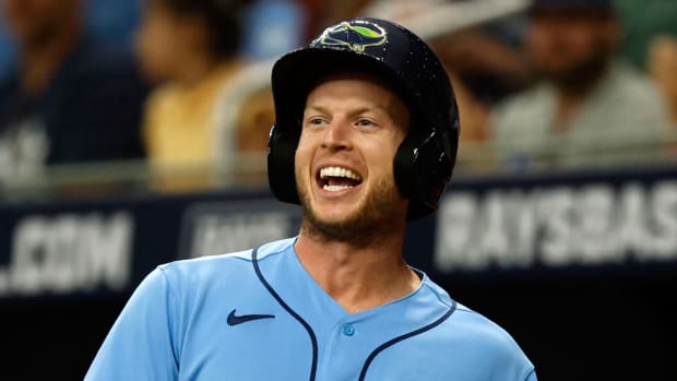 Tampa Bay Rays right fielder Brett Phillips (35) smiles after he scores a run.