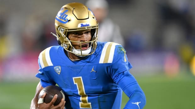 Nov 27, 2021; Pasadena, California, USA; UCLA Bruins quarterback Dorian Thompson-Robinson (1) runs for 17 yards and a first down against the California Golden Bears in the second half at the Rose Bowl.