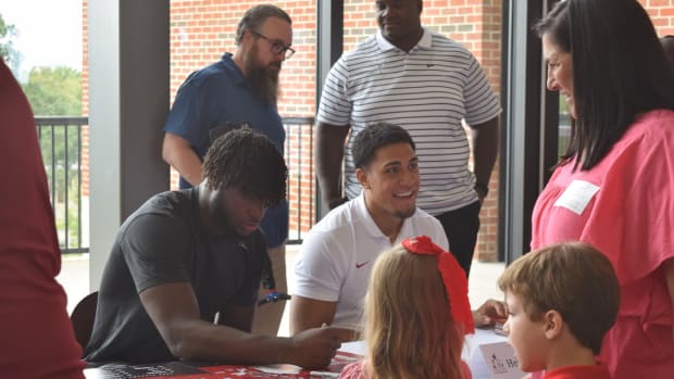 Will Anderson and Henry To'oTo'o sign autographs at Nick's Kids luncheon