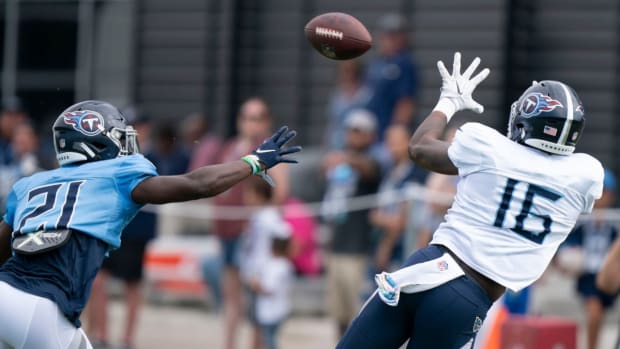 Tennessee Titans wide receiver Treylon Burks (16) pulls in a catch past cornerback Roger McCreary (21) during a training camp practice at Ascension Saint Thomas Sports Park Tuesday, Aug. 2, 2022, in Nashville, Tenn.