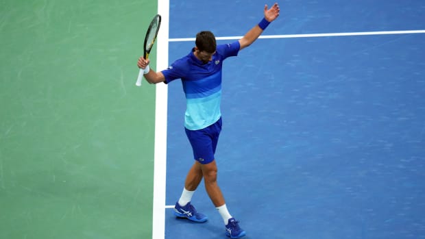 Novak Djokovic of Serbia reacts after winning a point in the third set against Jenson Brooksby of the United States on day eight of the 2021 U.S. Open tennis tournament.