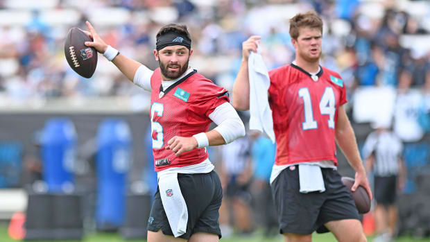 Jul 30, 2022; Spartanburg, South Carolina, US; Carolina Panthers quarterbacks Baker Mayfield (6) and Sam Darnold (14) on the field during training camp at Wofford College.