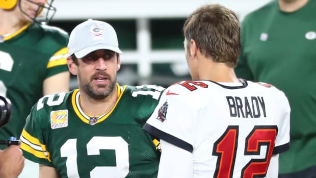 Tampa Bay Buccaneers quarterback Tom Brady (right) greets Green Bay Packers quarterback Aaron Rodgers (left) after a NFL game in 2020.