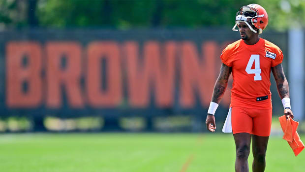Cleveland Browns quarterback Deshaun Watson walks on the field during NFL football training camp in Berea, Ohio, Friday, July 29, 2022. Watson was suspended without pay for six games Monday, Aug. 1, 2022, for violating the NFL’s personal conduct policy following accusations of sexual misconduct made against him by two dozen women in Texas, two people familiar with the decision said.