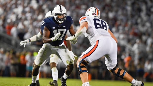 Penn State defensive end Arnold Ebiketie (17) rushes against Auburn offensive lineman Austin Troxell (68) during an NCAA college football game in State College, Pa., on Saturday, Sept.18, 2021. (AP Photo/Barry Reeger)