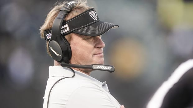 Raiders head coach Jon Gruden looks ahead on the sidelines during a game.