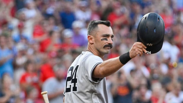 Aug 5, 2022; St. Louis, Missouri, USA; New York Yankees designated hitter Matt Carpenter (24) salutes the fans as he receives a standing ovation before his first at bat during the first inning against the St. Louis Cardinals at Busch Stadium.