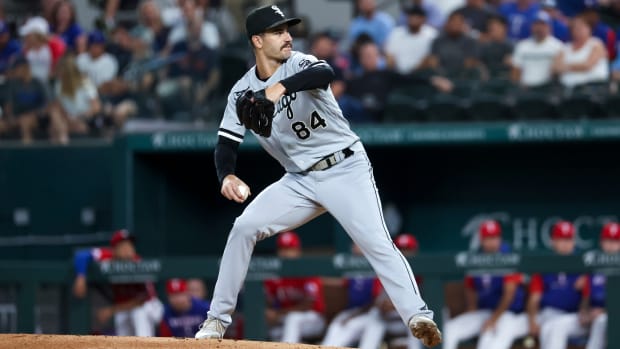 White Sox starting pitcher Dylan Cease (84) throwsa pitch during the first inning of a game against the Rangers.