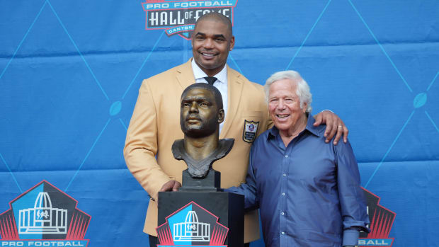 Aug 6, 2022; Canton, OH, USA; Richard Seymour with New England Patriots owner Robert Kraft and his bust during the Pro Football Hall of Fame Class of 2022 enshrinement ceremony at Tom Benson Hall of Fame Stadium.