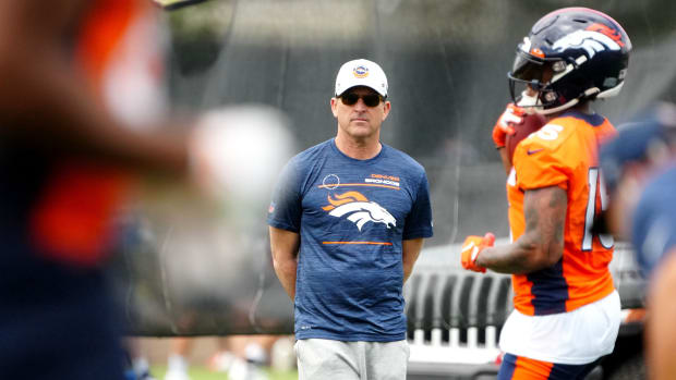 Denver Broncos general manager George Paton observes OTA workouts at the UC Health Training Center.