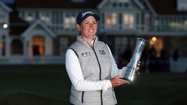 South Africa’s Ashleigh Buhai poses for the media while holding the trophy after winning the Women’s British Open golf championship.