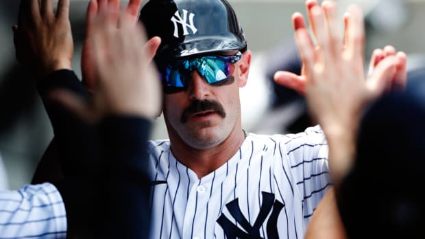 New York Yankees designated hitter Matt Carpenter (24) celebrates in the dugout after scoring against the Kansas City Royals during the fifth inning of a baseball game, Sunday, July 31, 2022, in New York. (AP Photo/Noah K. Murray)