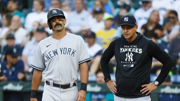 New York Yankees slugger Matt Carpenter reacts to foot injury with manager Aaron Boone