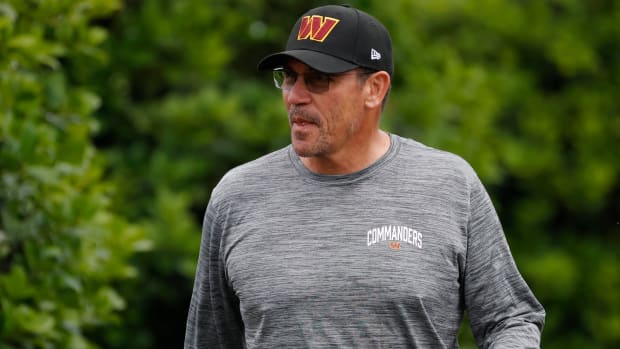 Commanders head coach Ron Rivera walks to the field during day three of training camp practice.