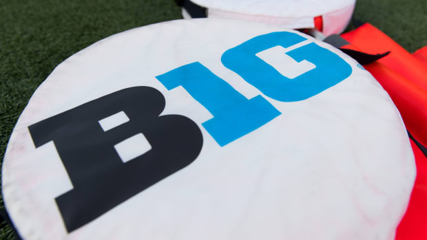 The Big Ten logo is seen on yardage markers during warmups prior to a game between the Western Kentucky and Wisconsin.