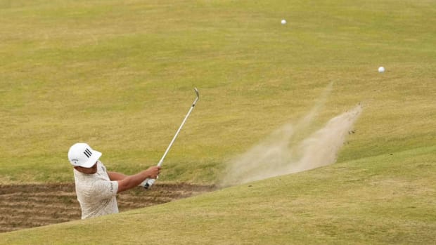 Jul 16, 2022; St. Andrews, SCT; Xander Schauffele hits out of a bunker on the 13th hole during the third round of the 150th Open Championship golf tournament. Mandatory Credit: Rob Schumacher-USA TODAY Sports