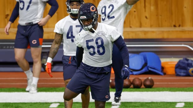 Bears linebacker Roquan Smith (58) warms up during organized team activities at Halas Hall.