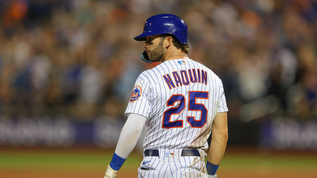 Aug 8, 2022; New York City, New York, USA; New York Mets right fielder Tyler Naquin (25) looks back after his two RBI triple during the eighth inning against the Cincinnati Reds at Citi Field.