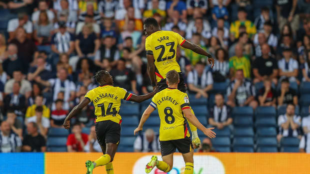 Ismaila Sarr pictured celebrating after scoring a goal from inside his own half for Watford against West Brom in August 2022