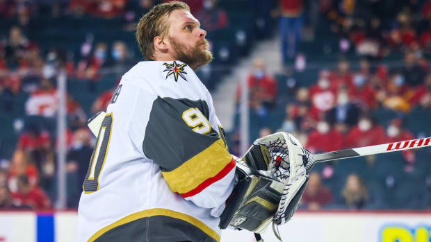Golden Knights goalie Robin Lehner looks up with his helmet off during a game.