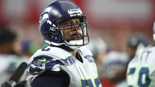 Seahawks tackle Duane Brown looks up during a game.