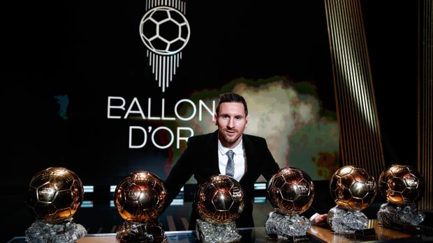Lionel Messi pictured in 2019 with his six Ballon d'Or trophies