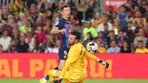Rayo Vallecano goalkeeper Stole Dimitrievski pictured making a save against Robert Lewandowski on the striker's Barcelona debut in August 2022