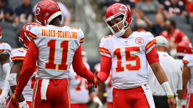 Aug 13, 2022; Chicago, Illinois, USA; Kansas City Chiefs quarterback Patrick Mahomes (15) warms up with wide receiver Marquez Valdes-Scantling (11) before a game against the Chicago Bears at Soldier Field. Mandatory Credit: Jamie Sabau-USA TODAY Sports