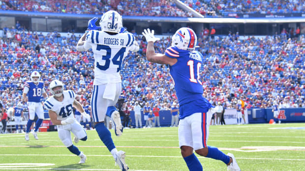 Aug 13, 2022; Orchard Park, New York, USA; Indianapolis Colts cornerback Isaiah Rodgers (34) makes an interception over Buffalo Bills wide receiver Khalil Shakir (10) in the second quarter pre-season game at Highmark Stadium. Mandatory Credit: Mark Konezny-USA TODAY Sports