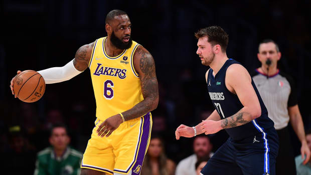 LeBron James being defended by Luka Dončić.