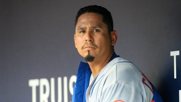 Aug 15, 2022; Atlanta, Georgia, USA; New York Mets starting pitcher Carlos Carrasco (59) in the dugout against the Atlanta Braves in the first inning at Truist Park.