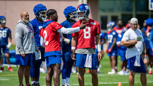 Jul 27, 2022; East Rutherford, NJ, USA; New York Giants quarterback Tyrod Taylor (2) and New York Giants quarterback Daniel Jones (8) chat during training camp at Quest Diagnostics Training Facility.