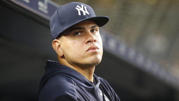 Yankees reliever Dellin Betances looks on in the dugout during a game.