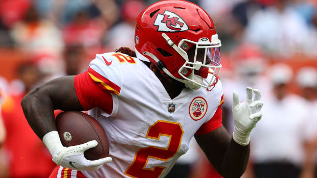 Aug 13, 2022; Chicago, Illinois, USA; Kansas City Chiefs running back Ronald Jones (2) rushes the ball against the Chicago Bears during the first half at Soldier Field. Mandatory Credit: Mike Dinovo-USA TODAY Sports