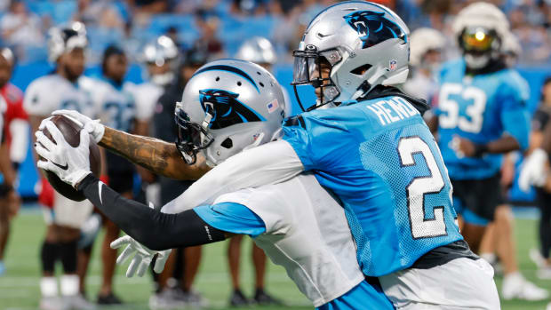 Panthers wide receiver Robbie Anderson, right, catches a pass against cornerback C.J. Henderson.