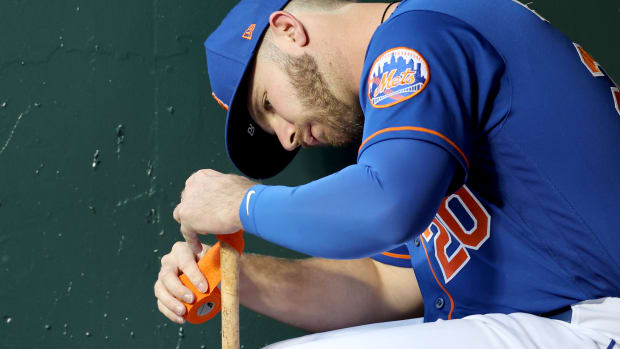 Jun 16, 2022; New York City, New York, USA; New York Mets first baseman Pete Alonso (20) tapes his bat in the dugout before a game against the Milwaukee Brewers at Citi Field.
