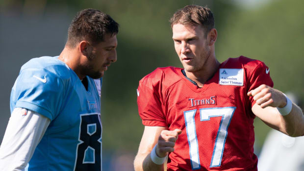 Tennessee Titans quarterback Ryan Tannehill (17) talks with tight end Austin Hooper (81) during a joint training camp practice against the Tampa Bay Buccaneers at Ascension Saint Thomas Sports Park Thursday, Aug. 18, 2022, in Nashville, Tenn.