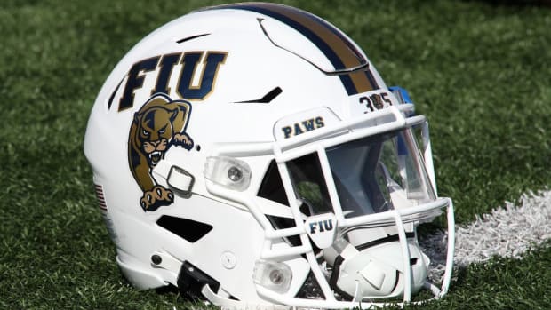 A Florida International Panthers football helmet on the field.