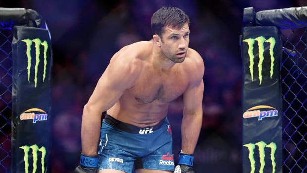 Luke Rockhold (blue gloves) before his fight against Jan Blachowicz (not pictured) at T-Mobile Arena.