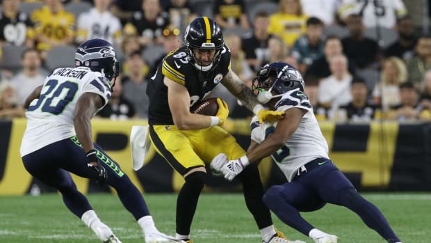 Aug 13, 2022; Pittsburgh, Pennsylvania, USA; Pittsburgh Steelers tight end Jace Sternberger (85) runs after a catch against Seattle Seahawks cornerback Mike Jackson (30) and cornerback Coby Bryant (8) during the second quarter at Acrisure Stadium. The Steelers won 32-25. Mandatory Credit: Charles LeClaire-USA TODAY Sports