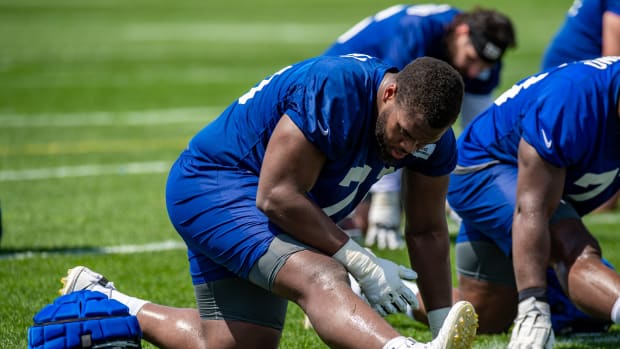 Jul 27, 2022; East Rutherford, NJ, USA; New York Giants offensive lineman Evan Neal (70) stretches during training camp at Quest Diagnostics Training Facility.